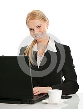 Beautiful business woman working on laptop