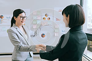 Beautiful business women having meeting in company