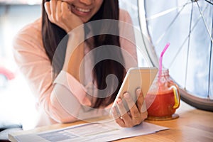 Beautiful business working woman using Iphone