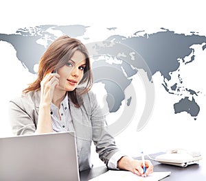 Beautiful businesswoman answering international calls