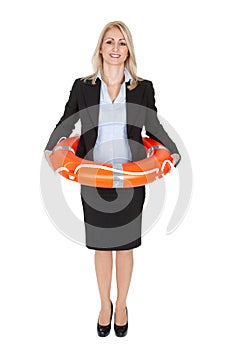 Beautiful businesswoman with life buoy