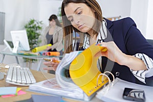 Beautiful businesswoman while looking at folder