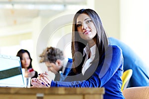 Beautiful businesswoman sitting at the table