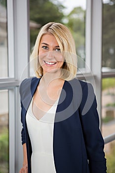 Beautiful businesswoman standing in conference centre