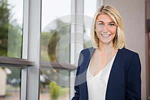 Beautiful businesswoman standing in conference centre