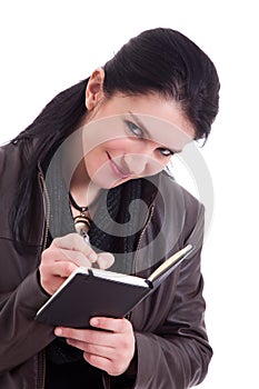 Beautiful businesswoman taking notes,