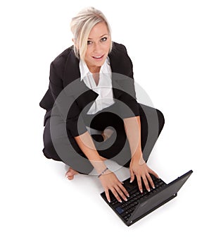 Beautiful businesswoman uses her netbook