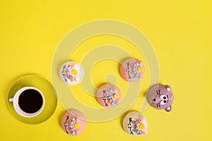 Beautiful cake and coffee on a yellow background