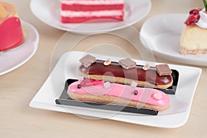 Beautiful cake and dessert on wooden table in pastel color - soft focus