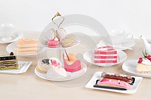 Beautiful cake and dessert on wooden table in pastel color - soft focus
