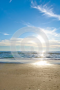 Beautiful, calm and quiet view of the beach, ocean and sea against a cloudy blue sky copy space background on a sunny