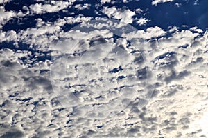 Beautiful calming fluffy white clouds in a deep blue summer sky