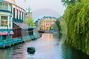 Beautiful canal in evening in the old city of Amsterdam, Netherlands, North Holland province.