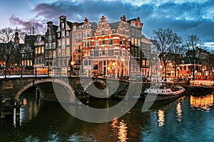 Beautiful canal houses on the corner of Brouwersgracht and Prinsengracht in the old center of Amsterdam during sunset