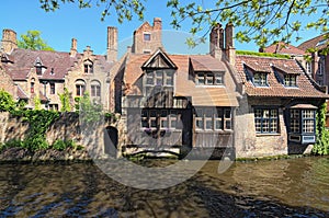 Beautiful canal and old, traditional houses in the town of Bruges dutch: Brugge, Belgium. Spring landscape photo