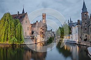 Beautiful canal and traditional houses at dusk in the old town of Bruges Brugge, Belgium