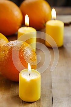 Beautiful candles and juicy oranges
