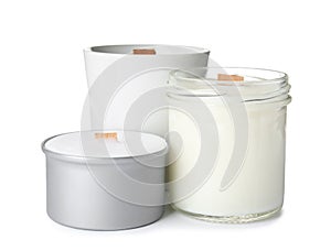 Beautiful candles with wooden wicks on white background