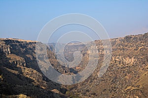 Beautiful canyon and in the distance the Saghmosavank church, Hovanavan, Armenia photo
