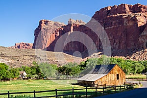Beautiful canyon red rocks and Gifford barn at the farm at the Fruita Oasis in Capitol Reef National Park in Utah