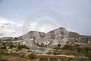 Beautiful Cappadocia landscape. Unique geological formations with stone rock houses and caves