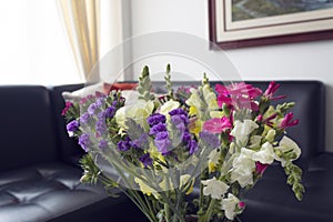 Beautiful capture of a bounch colorful and summer flowers decorating the living rooom