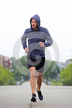 Beautiful carefree middle age runner outside photo