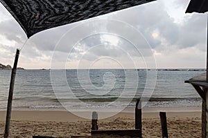 Beautiful caribbean sea dusk landscape viewed through a natural frame in a roustic hut at la piscina beach