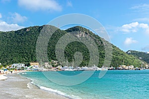 Beautiful Caribbean summer day with turquoise blue white sand beach on the coastline in Philipsburg, Sint Maarten