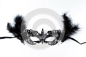 Beautiful carnival mask of black lace on a white background
