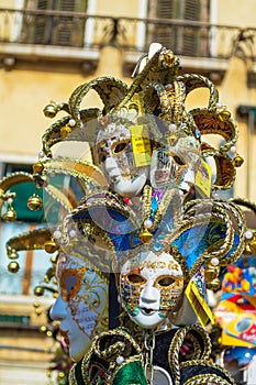 Spectacular Venice carnival masks on street stand display Italy
