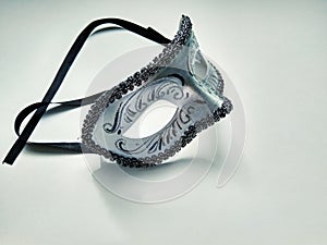 Beautiful carnival silver mask with patterns on white background