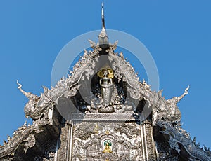 Beautiful carved patterns of silver metal in northern Thailand temples