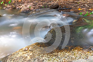 beautiful cascading waterfall over rocks long exposure in Chiangmai Chiang mai mountains northern thailand