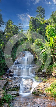 beautiful cascading waterfall over rocks long exposure in Chiangmai Chiang mai mountains northern thailand