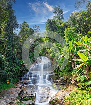 beautiful cascading waterfall over rocks long exposure in Chiangmai Chiang mai mountains northern thailand