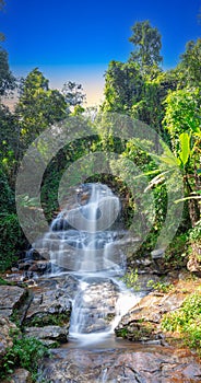 beautiful cascading waterfall over rocks long exposure in Chiangmai Chiang mai mountains northern thailand