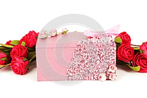 Beautiful casket with flowers on white background