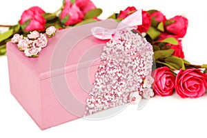Beautiful casket with flowers on white background.