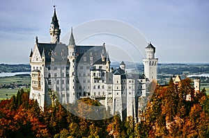 Beautiful castle Neuschwanstein in autumn sunny day