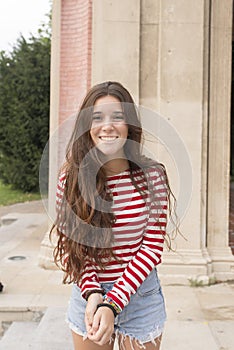 BEautiful casual woman with long hair posing at camera,outdoor.