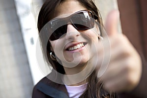 Beautiful casual woman with thumbs up