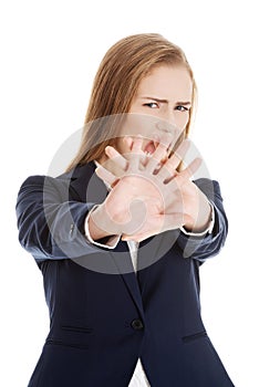 Beautiful caucasian business woman shows rejection and screams.