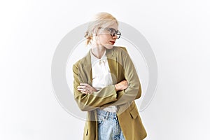 Beautiful caucasian business woman standing over isolated background looking to the side with arms crossed convinced and confident