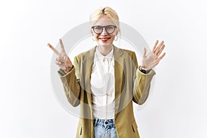Beautiful caucasian business woman standing over isolated background showing and pointing up with fingers number seven while
