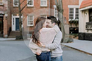 A happy young couple having a romantic moment in an urban setting in West Village in NYC