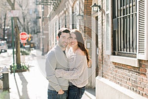 A happy young couple having a romantic moment in an urban setting in West Village in NYC