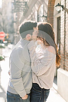 A happy young couple having a romantic moment in an urban setting in West Village in NYC