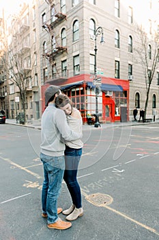 A young couple having a romantic moment in front of  famous