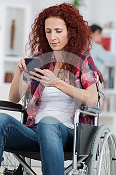 Beautiful caucasian disabled woman sitting wheel chair